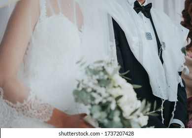 COUPLE BRIDE AND GROOM IN A JEWISH WEDDING