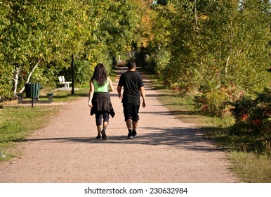 Couple brisk walking in dusty road - Shutterstock ID 230632984