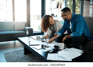 Couple with budget planning, bills and accounting of home, people with notes to pay loan and mortgage debt. Tax paperwork, man and woman happy with financial review of spending, income and savings - Powered by Shutterstock