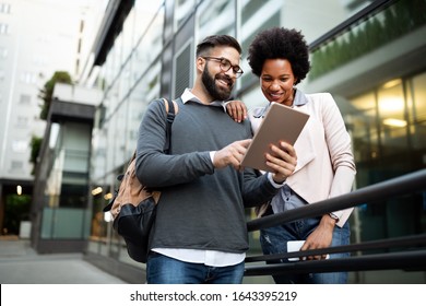 Couple, Business, Technology Concept. Businessman With Tablet And Woman With Smartphone Talking