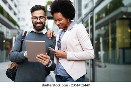 Couple, business, technology concept. Businessman with tablet and woman with smartphone talking
