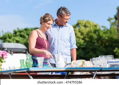 Couple Buying Stuff At Flea Market