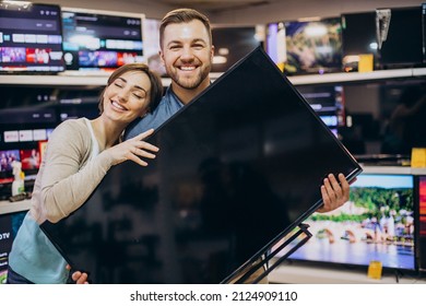 Couple Buying Television At Store