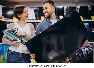 Couple Buying Television At Store