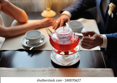 Couple In A Cafe Drinking Tea