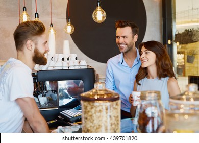 Couple At Cafe Talking Barista, Buying Coffee