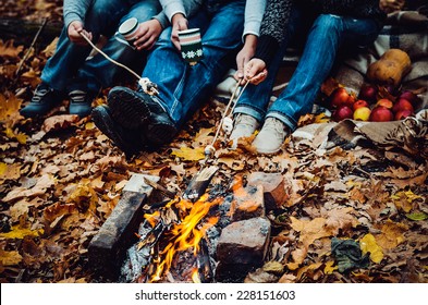 couple camping in the autumn forest. Fall background - Powered by Shutterstock