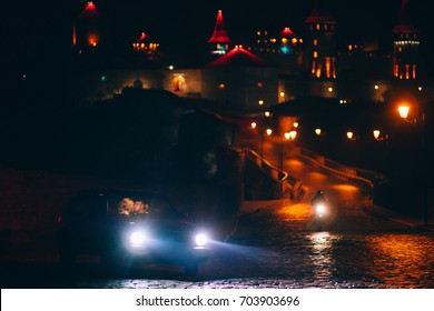 Couple In The Car With A Great Old Building Behind It