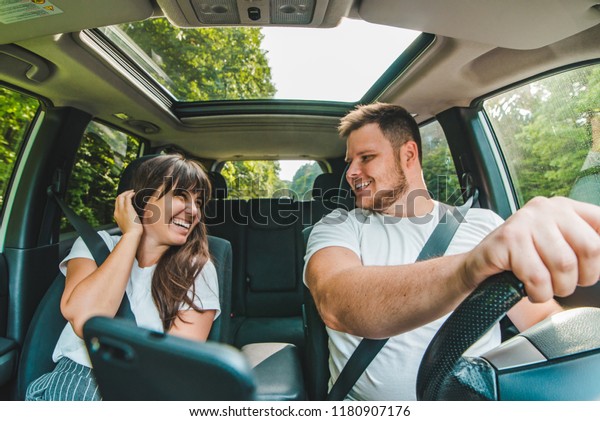 couple in car.\
long road trip. car travel\
concept