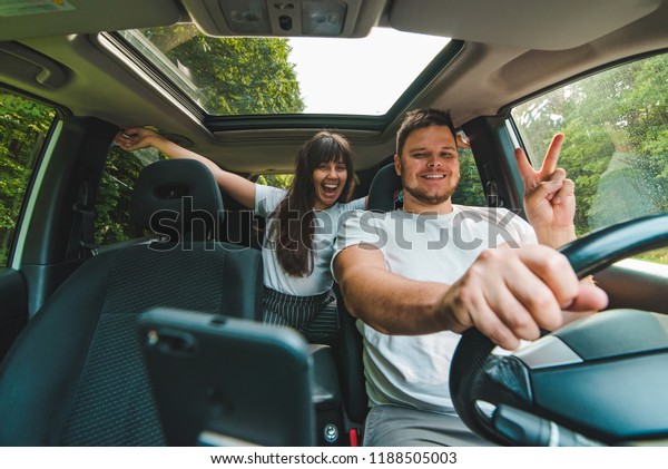couple in car.\
long road trip. car travel\
concept