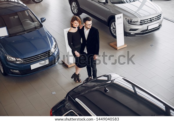 Couple in a car salon. Family buying the car.
Elegant woman with her
husband.