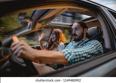 Couple In A Car At Sunset, With Man Driving Fast And Girl Scared, Screaming And Crying.
