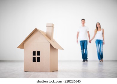 Couple With Cardboard House