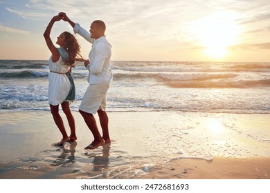 Couple, celebrate and dance on beach with outdoor romance, holiday and vacation by ocean or sunset space. Happy people spinning and holding hands with love and travel on anniversary or valentines day - Powered by Shutterstock