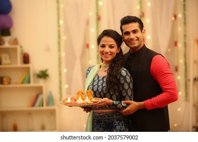 Couple celebrating diwali with full of happiness