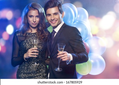 Couple Celebrating New Year's Eve With Champagne 