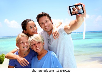 Couple and children taking family picture