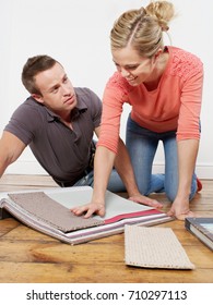 Couple Choosing Carpet Samples