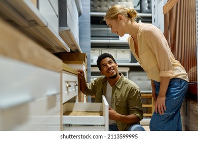 Couple Choosing New Kitchen Furniture In Shop