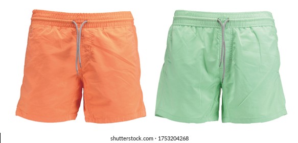 Couple of classic men’s swimwear Sports Quick Dry. Beach orange and green shorts Bermudas. Front view. Isolated image on a white background. - Shutterstock ID 1753204268