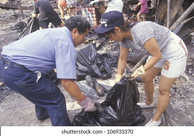 Couple Cleaning Up After 1992 Riots, South Central Los Angeles, California