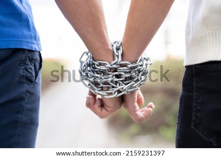 Couple Codependent Relationship. Partner Hands Chained Together