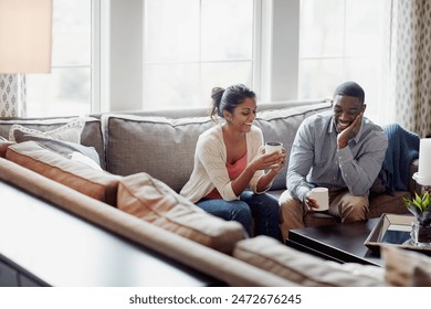 Couple, coffee and relaxing on sofa in morning for conversation or talk in living room. Discussion, woman and man with smile, happy and married with tea for day plan or romantic date in summer. - Powered by Shutterstock