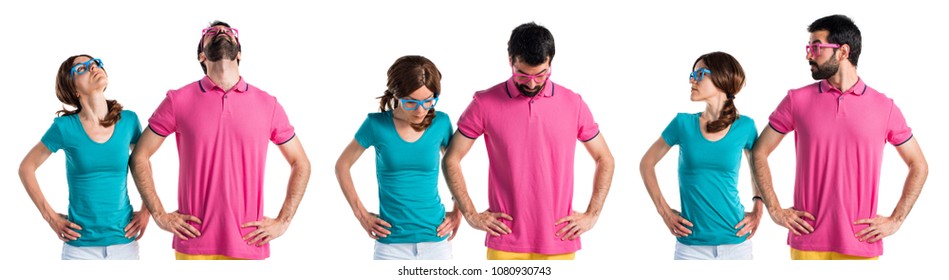 Couple in colorful clothes looking down - Shutterstock ID 1080930743