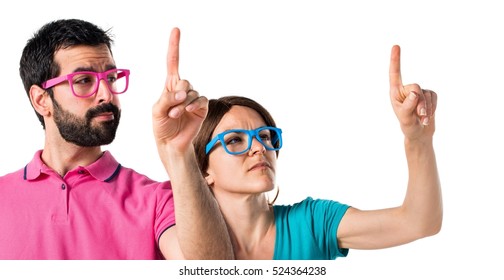 Couple In Colorful Clothes Touching On Transparent Screen