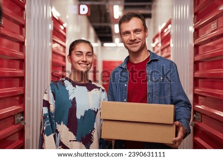 Couple in Corridor of Self-Storage Unit