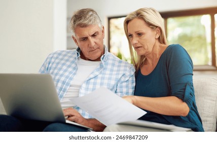 Couple, couch and document with laptop and read, finances or taxes for audit in living room. Paperwork, contract or online for mortgage investment, investment or man with female person in home lounge - Powered by Shutterstock