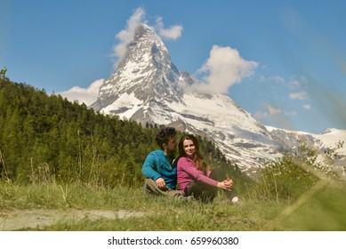 Couple cuddlng in the beautiful Alps, near Matterhorn and Zermatt, Switzerland, Europe 2017