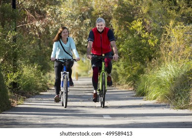 Couple cycling along urban bike-way in Adelaide - Shutterstock ID 499589413