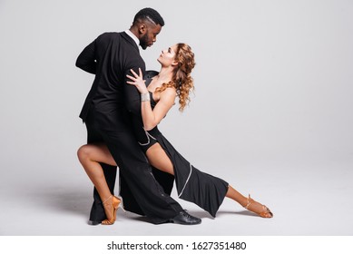 Couple Dancers Posing Over White Background. Dance School Concept