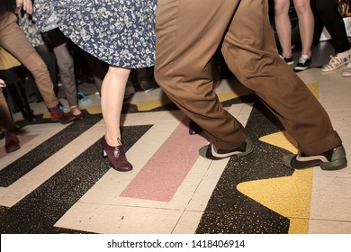 couple dancing lindy hop with swing 