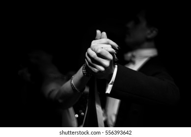 couple dancing on a dark background