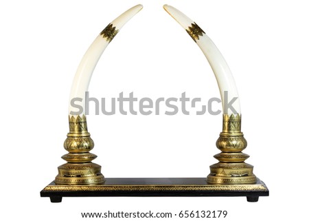 A couple of decorative ivory tusks isolated on white.