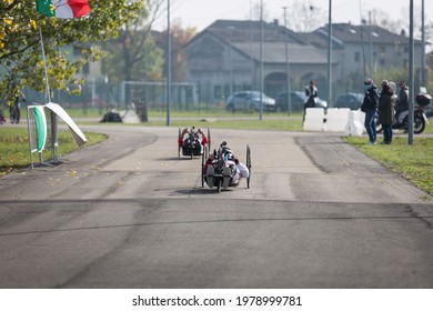 Couple Of Disabled Athlete Training With Their  Special Bikes On A Track