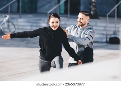 Couple do fitness workout and stretching in ubran city area. Active lifestyle