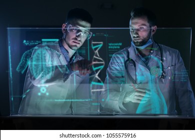 A Couple Of Doctors Analyze The Patient's Medical Situation By Checking On A Glass Monitor With A Futuristic Holography. Concept Of: Medicine, Doctors, Future, Holography.