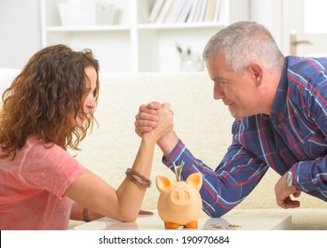 Couple Doing Armwrestling, Concept Of Fighting For Money