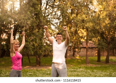 Couple Doing Conquer Pose After Run .