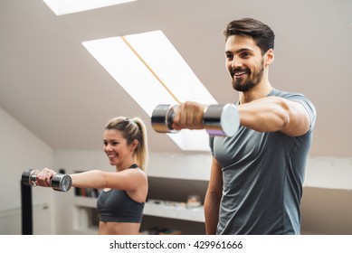 Couple doing morning fitness at home. - Powered by Shutterstock