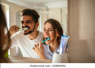 Couple doing a morning hygiene together.