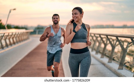 Couple doing sport together the street  Morning run