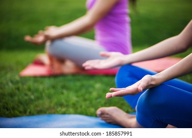 Couple Doing Yoga Outdoors