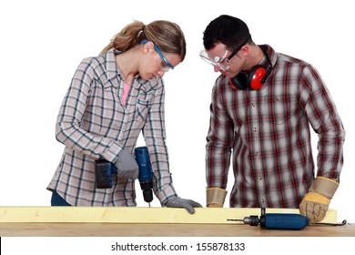 Couple Drilling Wood