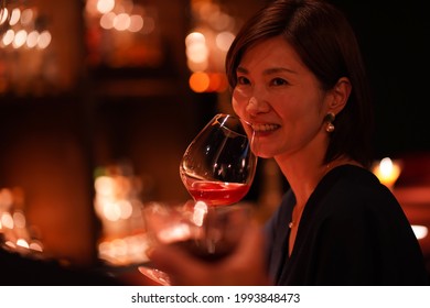 Couple Drinking Alcohol At The Bar 
