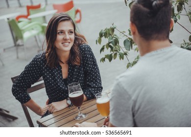 A Couple Drinking Beer Outside