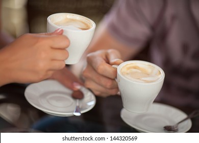 Couple Drinking Coffee At Cafe Restaurant Man And Woman With Cup Of Espresso Hot Cappuccino On Dating. Concept Of Male And Female Hands Love And Coffee. Italian Delicious Caffeine Drink Aroma Latte